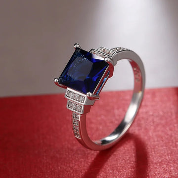 1 beautiful timeless ring set with square navy gemstones for an engagement or anniversary gift with elegant style